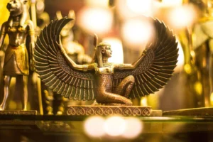 An image of a gold Egyptian winged figure from Egypt