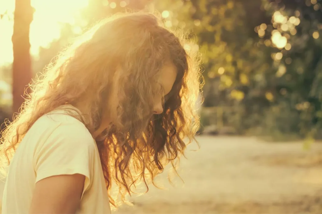 a celibate woman standing in the sunshine