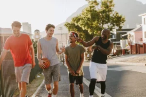 a group of guy friends after a game of basketball