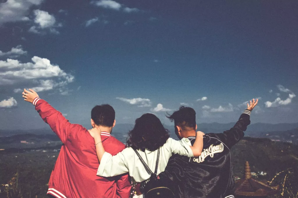 a group of friends hugging, not looking for independence