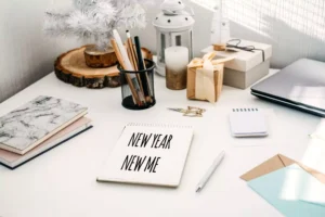 making plans for the year ahead - a notebook that says "New Year New Me"