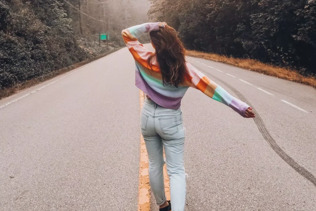a woman walking in the street, living our her testimony of faith and grace