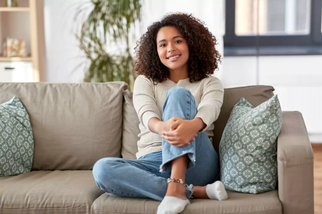 a girl sitting on a couch