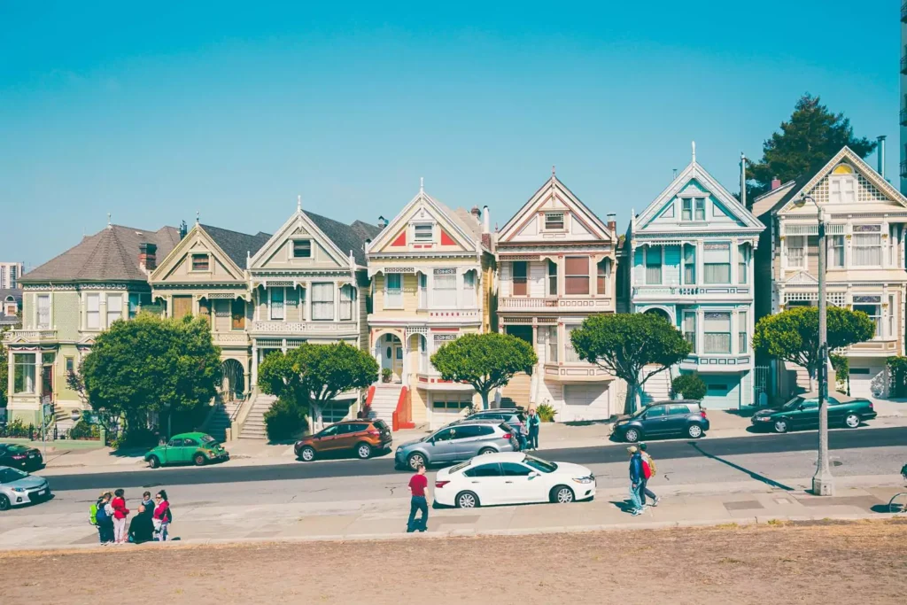 a neighborhood with people walking outside