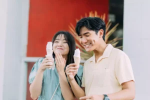 a awkward couple on a date, eating ice cream