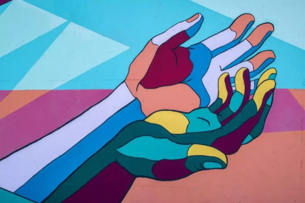 graffiti of hands cupped, an image of love in action