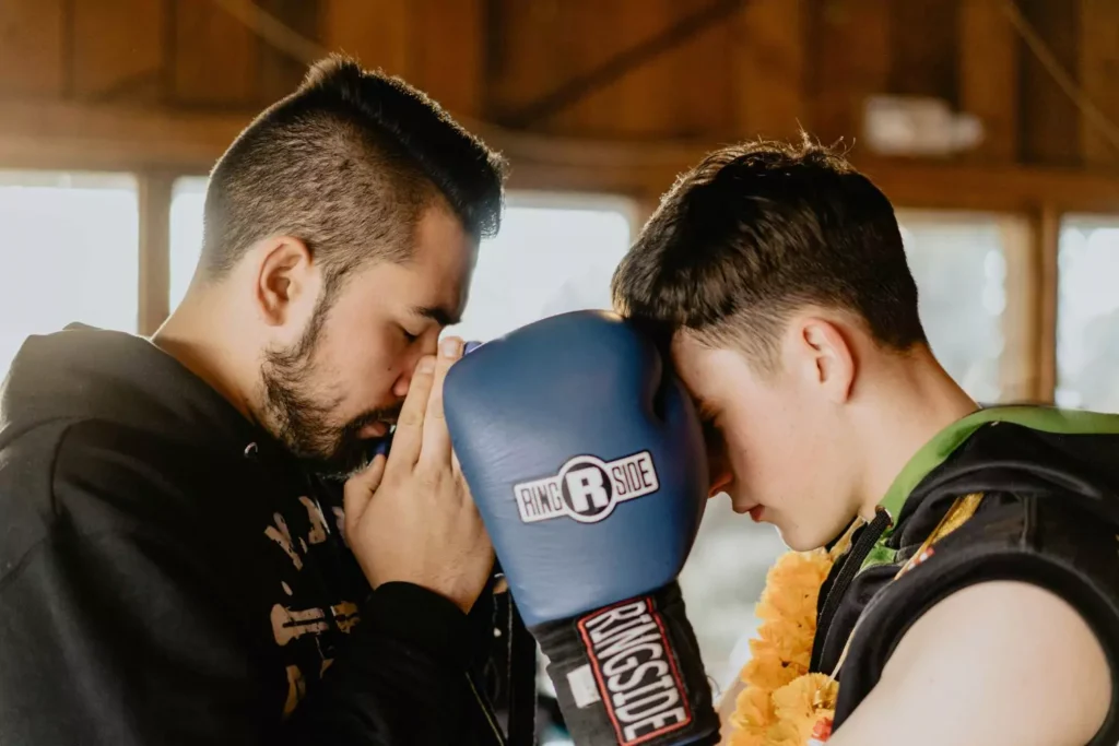 a young man and his mentor, boxing