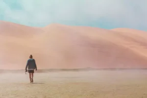 a woman walking in a desert, a symbol of lent