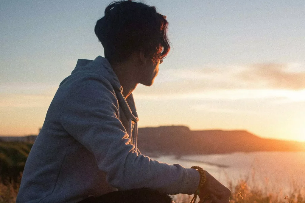 a man waiting for the sunset