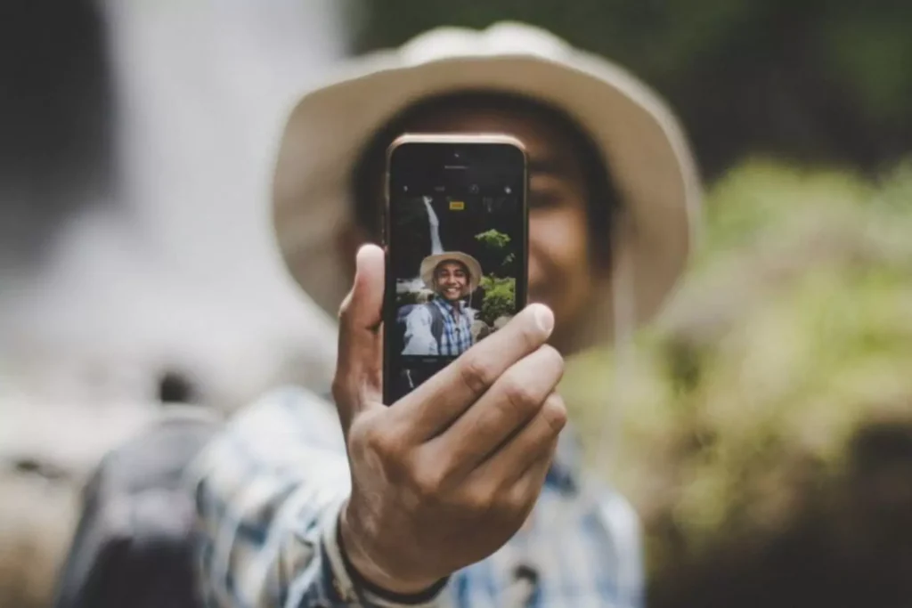 a person taking a selfie, working on their personal branding