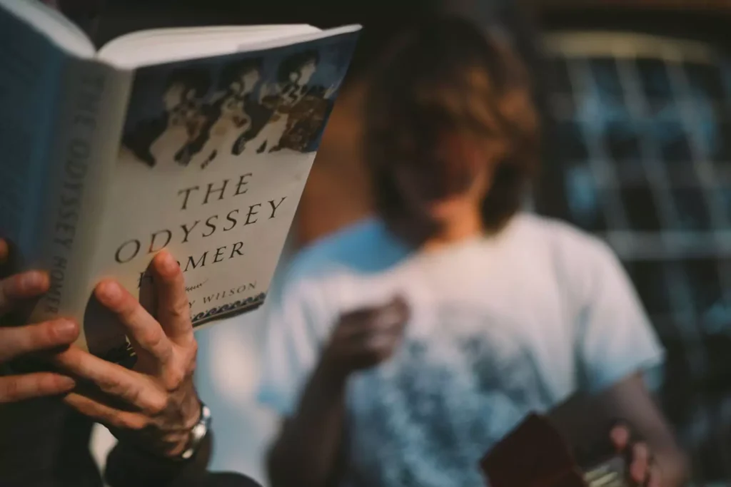 a person reading one of the Great Books - The Odyssey.