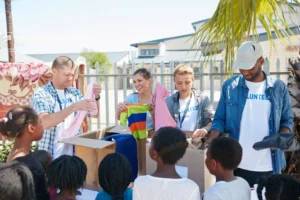 Missionaries handing out resources on their mission trip
