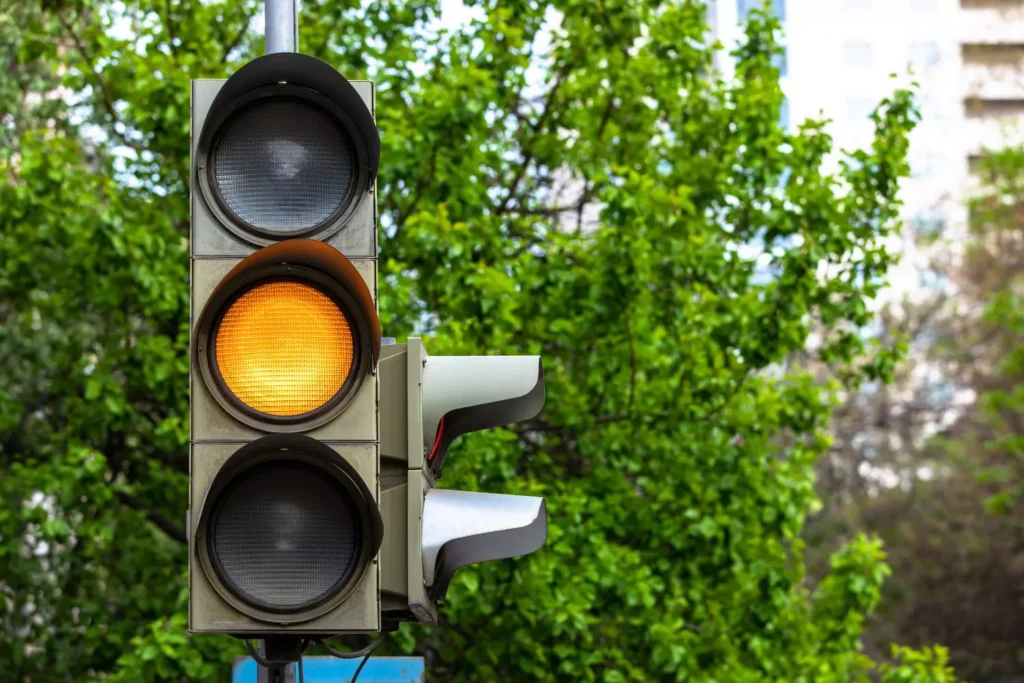 a yellow stoplight, symbol of waiting